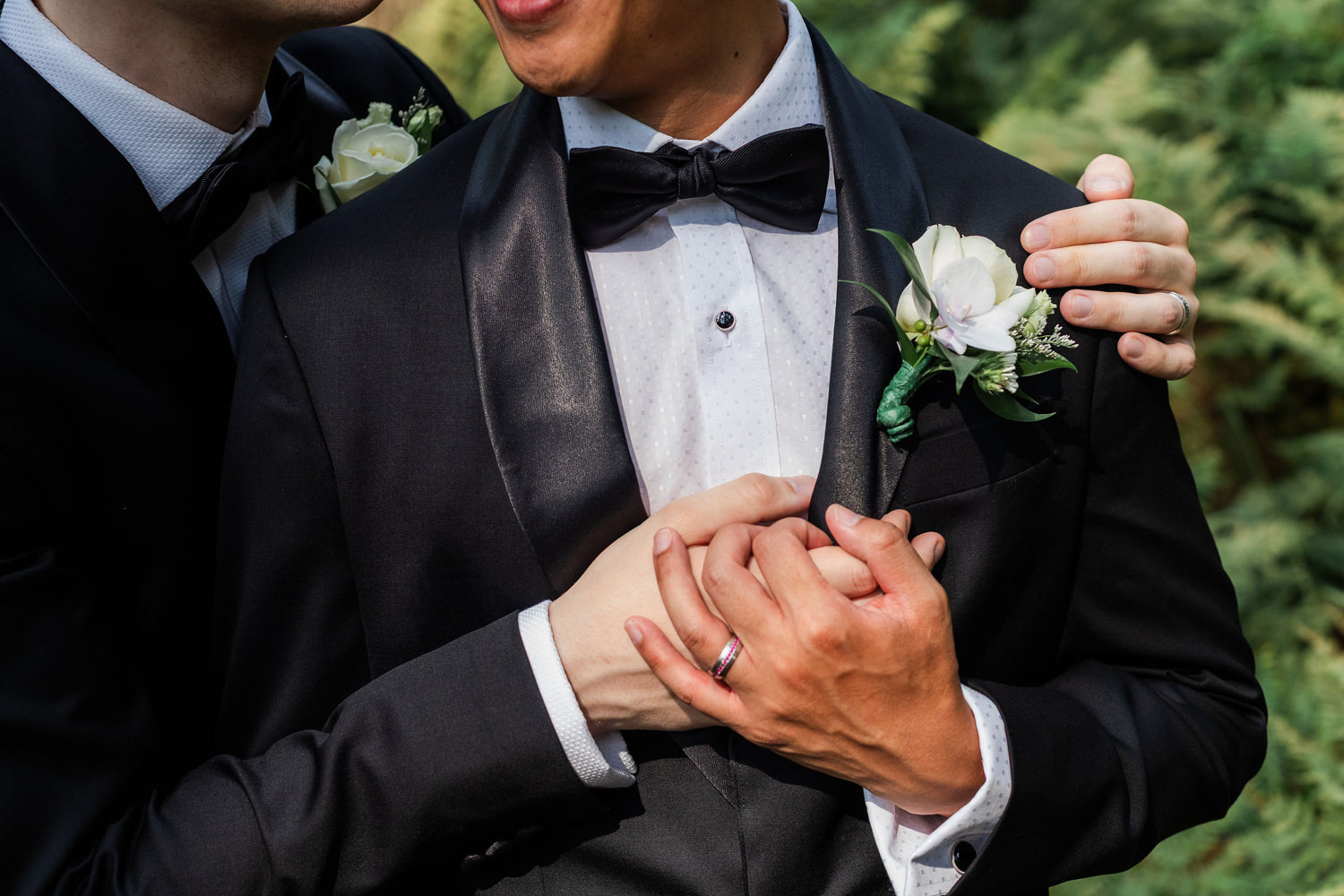 close up of hands of grooms 