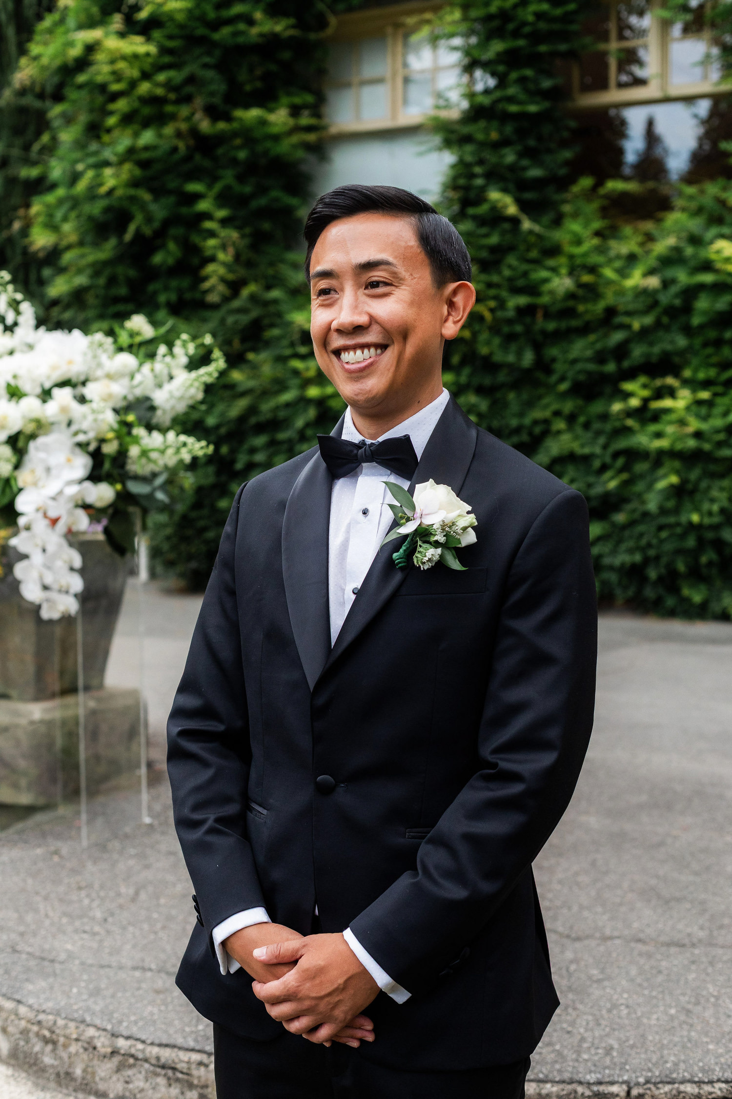 groom watches husband walk down the aisle